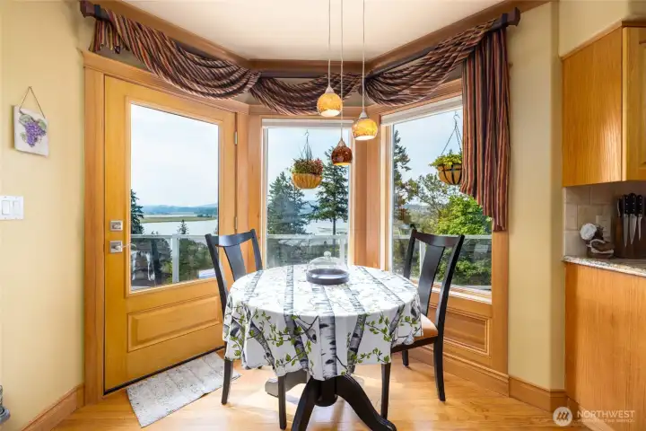 Breakfast nook has a door leading out to the deck.