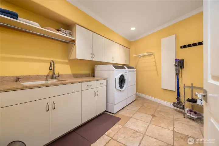 Laundry room with a large laundry sink is located on the main floor.