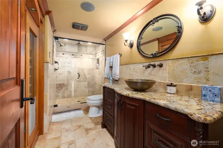Bathroom on the lower level has a walk in shower and a built in sauna.