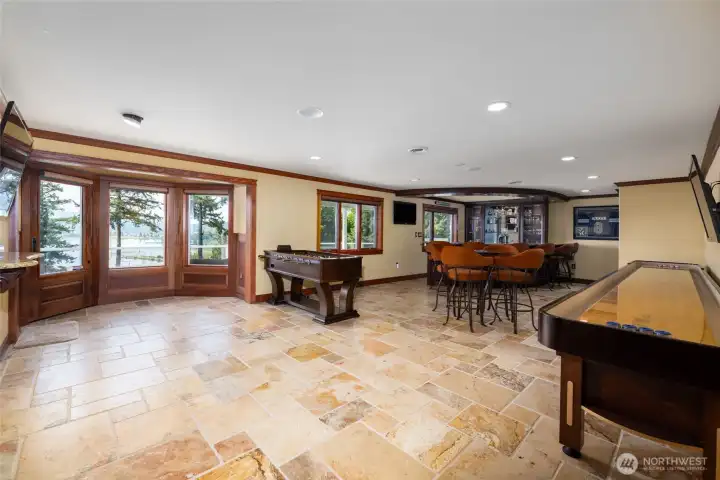Rec room is large and has room for game tables plus it has a wet bar and is just off the theater room
