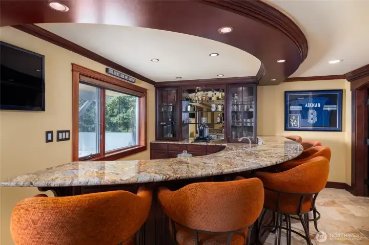 Bar on the lower level, has a sink, an ice maker, and a dishwasher
