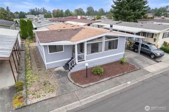 The large windows in this triple wide manufactured home bring in an abundance of natural light