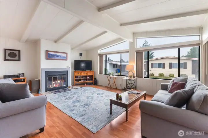 The living space has an attractive wood burning fireplace