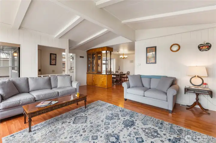 A cosy living space and the dining area beyond