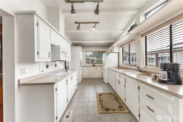 There is plenty of storage space in this large kitchen bathed in natural light