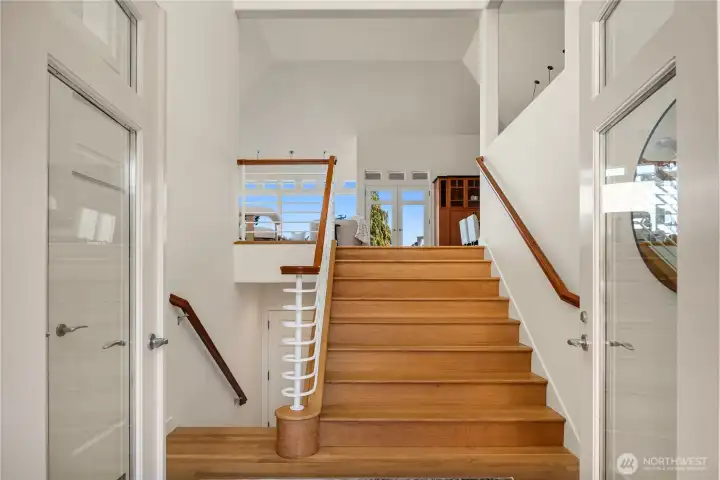The double door entry opens up to this grand staircase and formal reception area.