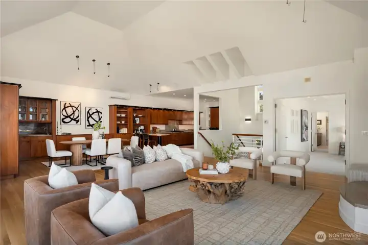 Looking across the massive living room towards the dining room and kitchen you can see some of the striking architectural details.