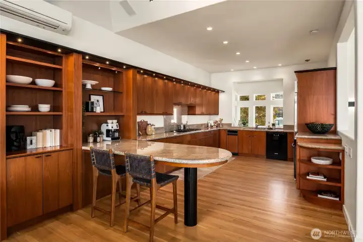 This enormous kitchen boasts great storage and counterspace, gas cooktop with separate wall oven and oversized sub-zero fridge.