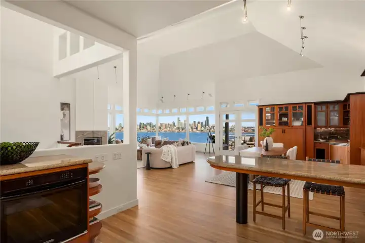 Looking back from the kitchen towards the great room and view. The built-in wall oven is to the left.