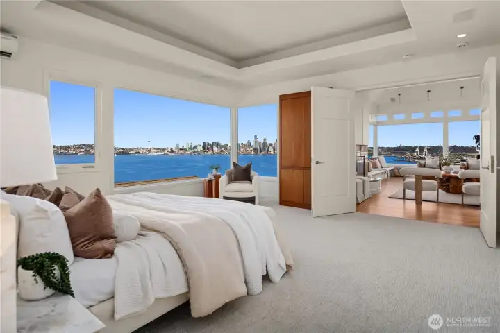 Wake up daily to these unbelievable views without even getting out of bed. A custom tv cabinet is behind the double doors.