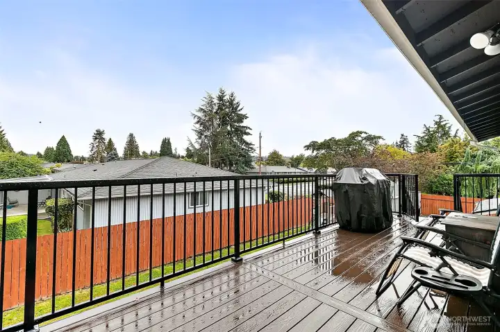 Large deck overlooking the backyard