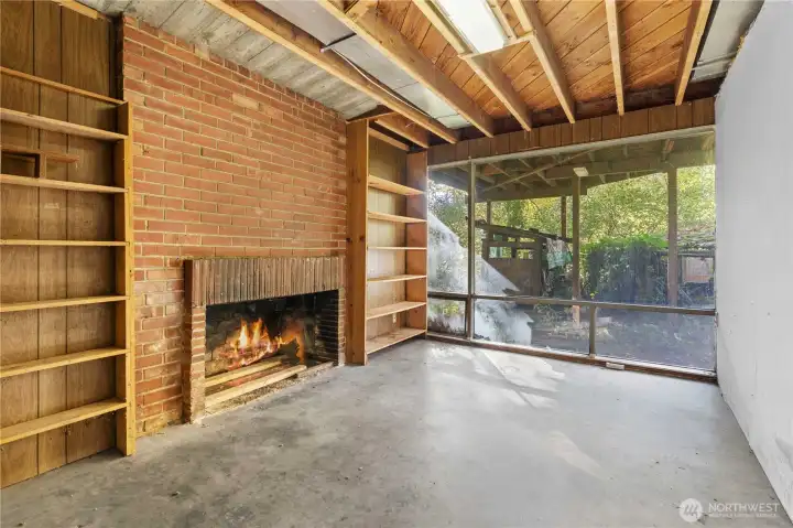 Downstairs den with wood burning fireplace