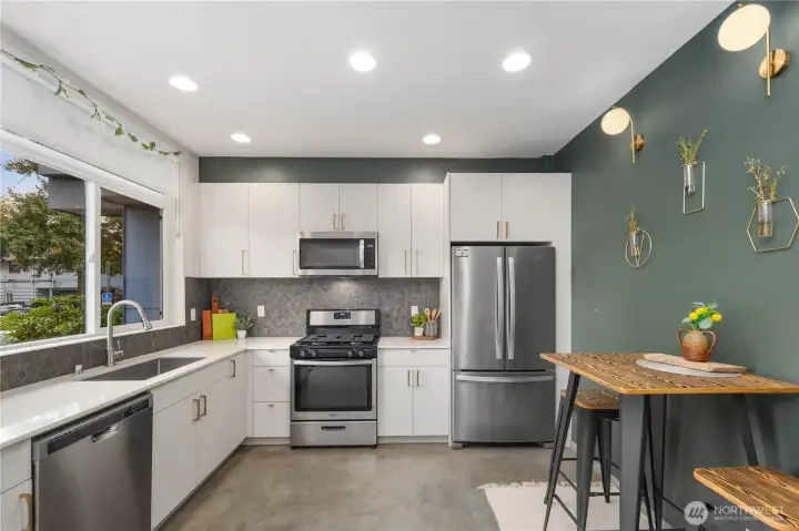 Large eat-in kitchen, with ample counter space, stainless appliances and gas range!