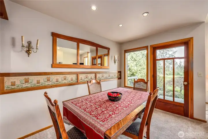 The welcoming dining room includes a door onto the back patio.