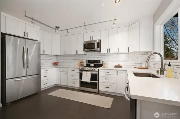 With SS appliances, quiet-close cabinets and marble counters.