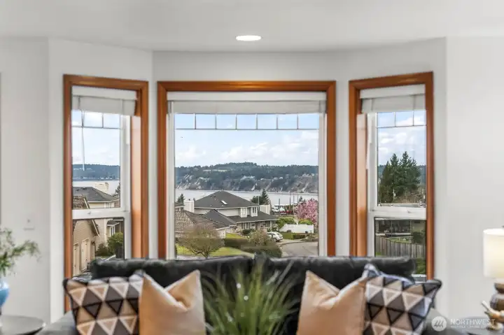 See whales and boats and mountains at sunset!