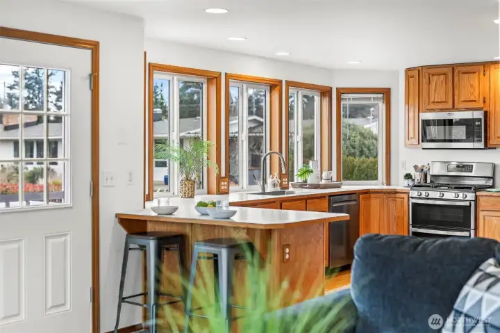 Counter seating and access to deck right off the kitchen.