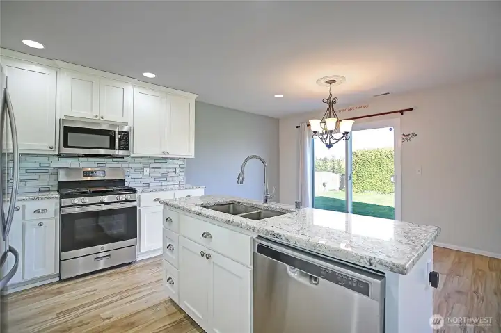 Custom cabinets, stainless steel appliances.