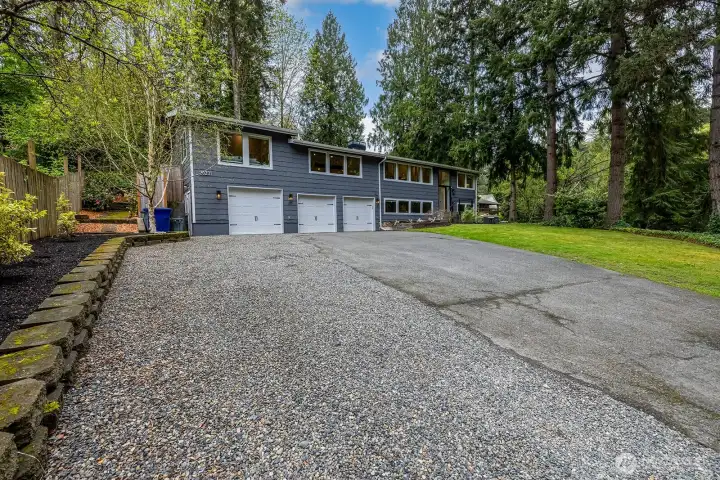 This house sits proudly back from the street up on the top of the gentle slope and offers off street parking for your biggest party!  RV parking is very easy, as well as your extra toys. The third bay is oversized to accommodate a larger vehicle or boat.