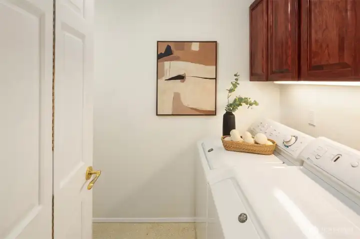 Dedicated laundry room with plenty of storage
