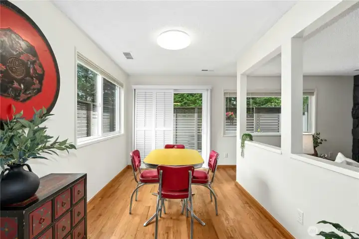 View from kitchen out sliding glass doors with custom venetian blinds