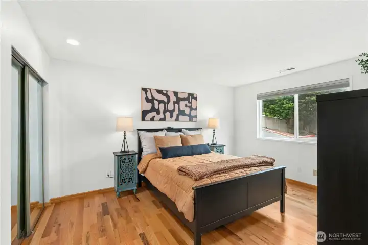 Spacious primary bedroom | Plenty of room for king size bed (shown with queen)