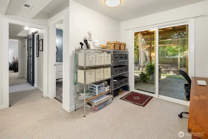 Perfect work from home space or hobby room. Slider to small patio and yard