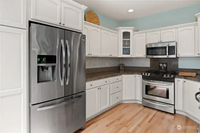 Bright Kitchen with Stainless Steel Appliances