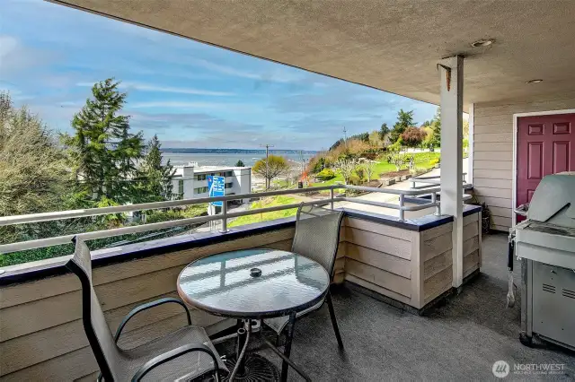 The large full length of unit covered deck.  A great space for relaxing with your morning coffee or bringing in your guests to enjoy an afternoon BBQ