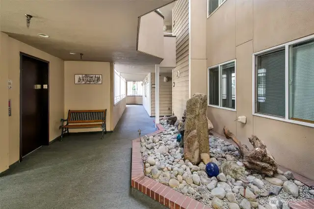 Here is the common area of The Park Place. Elevator to your left.  This unit doesn't need the elevator (except from the garage) to access day to day.