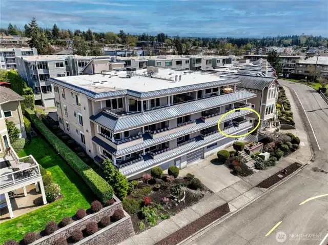 And this photo shows off the unit #101 off the street and above the well maintained and small condo complex.