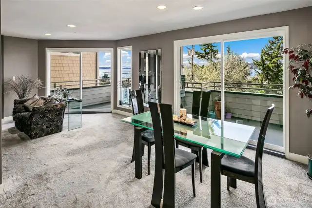 Dining room is large and easily can have a table for 8.  Double slider system doors to the full length deck out to your view and the sounds of Puget Sound.