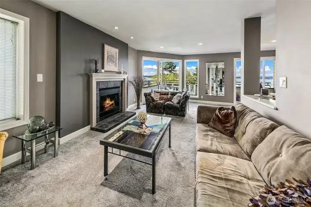 Living room boasts a gas fireplace.  Newer carpet and pad throughout the condo