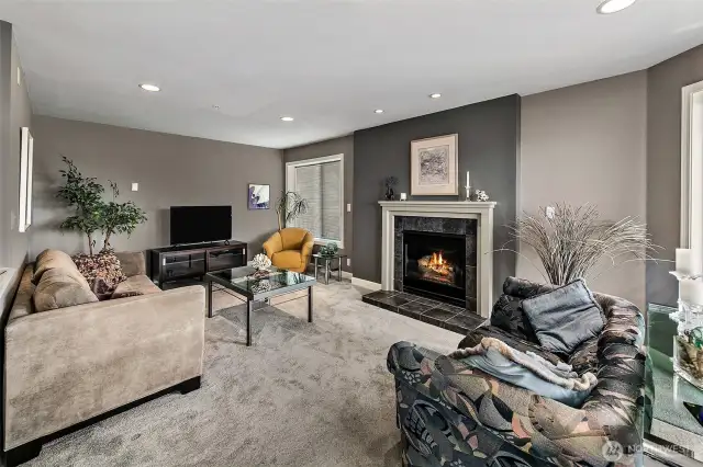 Living room looking towards the TV area and sitting spaces.