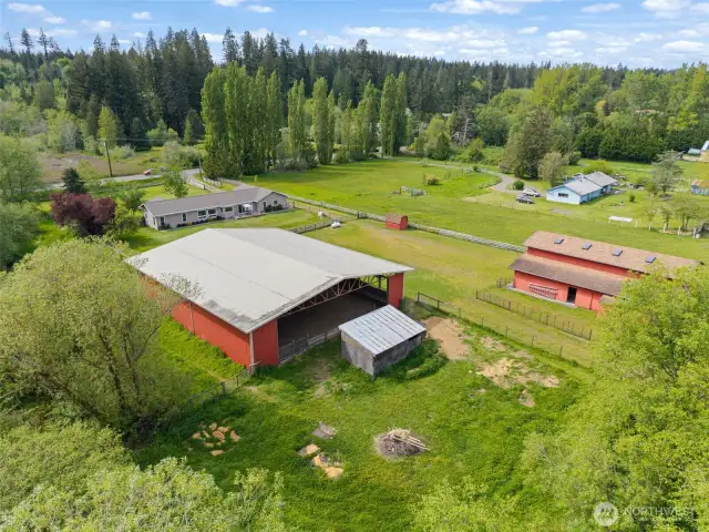 Covered arena, chicken coop, cross fenced pasture, barn and then house. This is just the front half of the property.