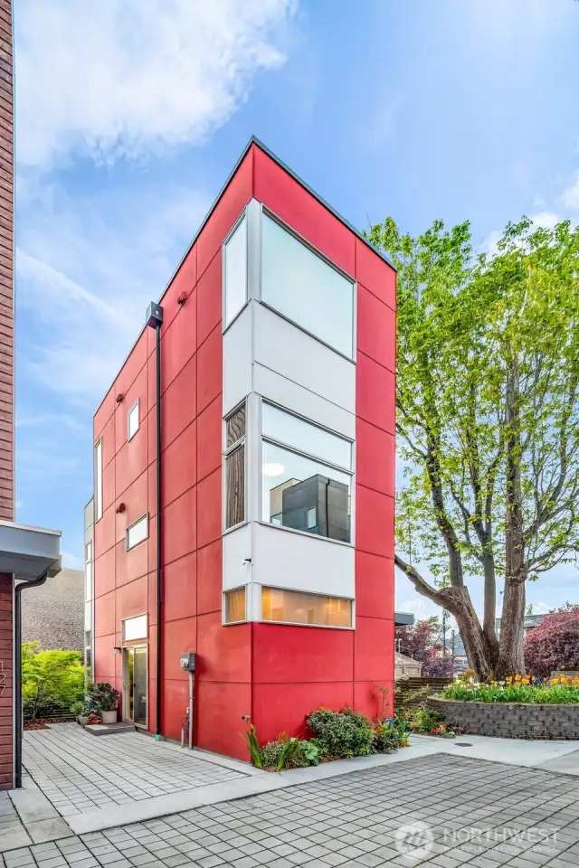 Beautiful stand alone home with no HOA dues, chalk full of upgrades (blinds, black out curtains, Kitchen Aid deluxe appliances (gas cooking and fire) hardwoods throughout and simply a stunning 3 bed 2.5 bath home in Squire Park area of Seattle on Capitol Hill!! (reserved parking, carport or additional storage included)