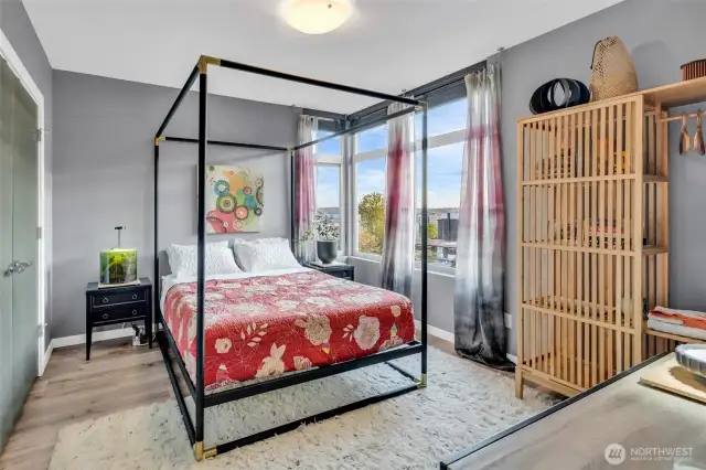 Two Huge Guest Bedrooms (four post queen bed shown) with large closets, Southwest facing, super high ceilings and plenty of privacy given it's a stand alone home!