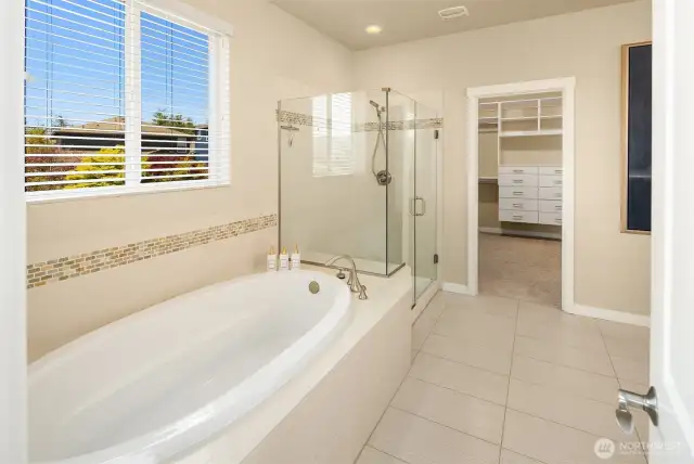 NW package upgrades includes large tub, frameless shower, extended tile and vanities