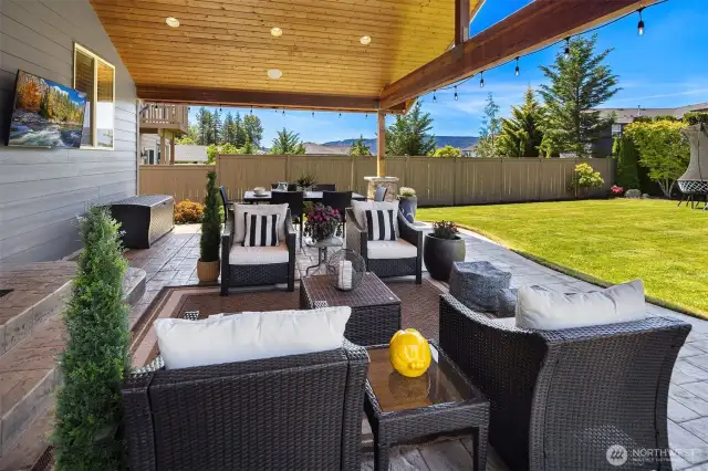 Extended stamped concrete patio, ceiling speakers, outdoor TV