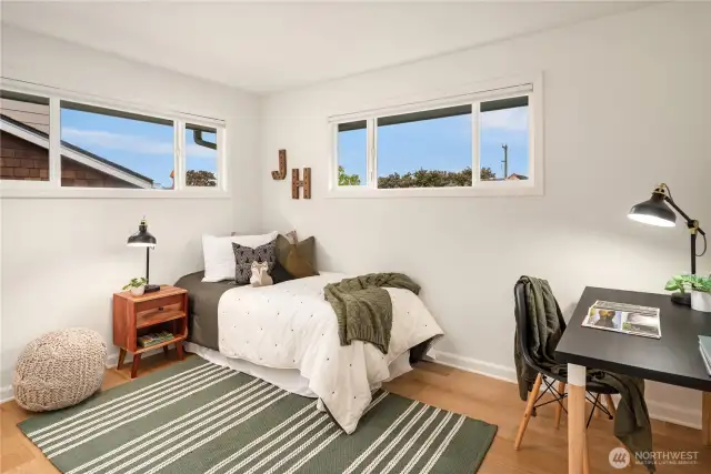 The second bedroom located on the main floor features peek views of the Puget Sound.