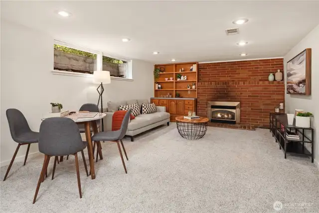 Just down the new wood stairs is a full basement. This enormous rec room with a wood burning fireplace is one of the prominent features.