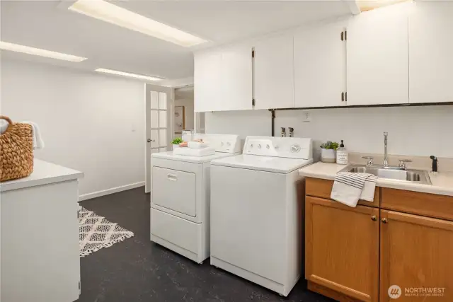 More than ample storage, a laundry sink and gorgeous linoleum flooring. There are 2 more large storage rooms in addition this and the bedrooms & home office.