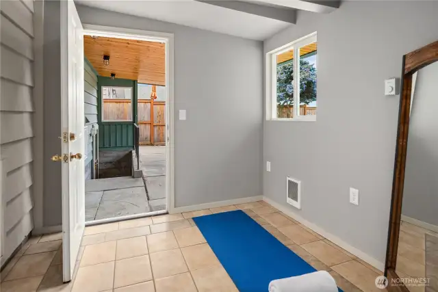 Just off the garage and up the covered stairs from the laundry room is this finished and heated studio perfect for a home office or excercise room.