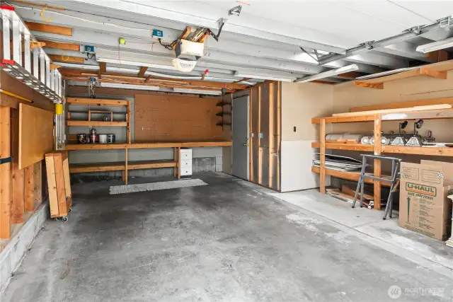 This oversized garage features 2 separate man doors and storage areas in the back and to the side AND ROOM for a large car. Equipped with an automatic opener of course.