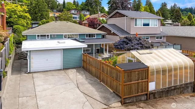 A paved alley leads to the off-street parking for 2 and garage.