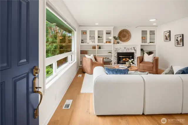 The formal entry opens up to brand new engineered hardwood floors and a spacious formal living room.