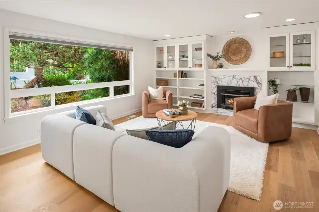 Freshly painted throughout with new wood flooring and built-in cabinetry.