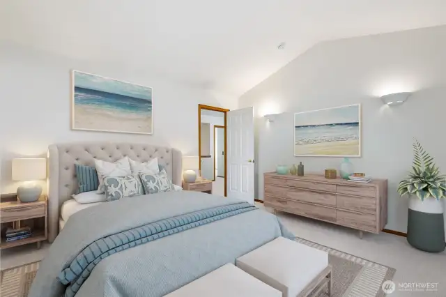 Primary suite with vaulted ceiling, walk-in closet and a 5 piece bathroom.