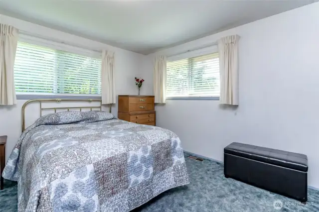 Bedrom 2. Hardwood floors under carpet have been covered since 1970's