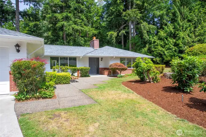 Another view of the front of the home.Mature landscaping with  sprinkler system